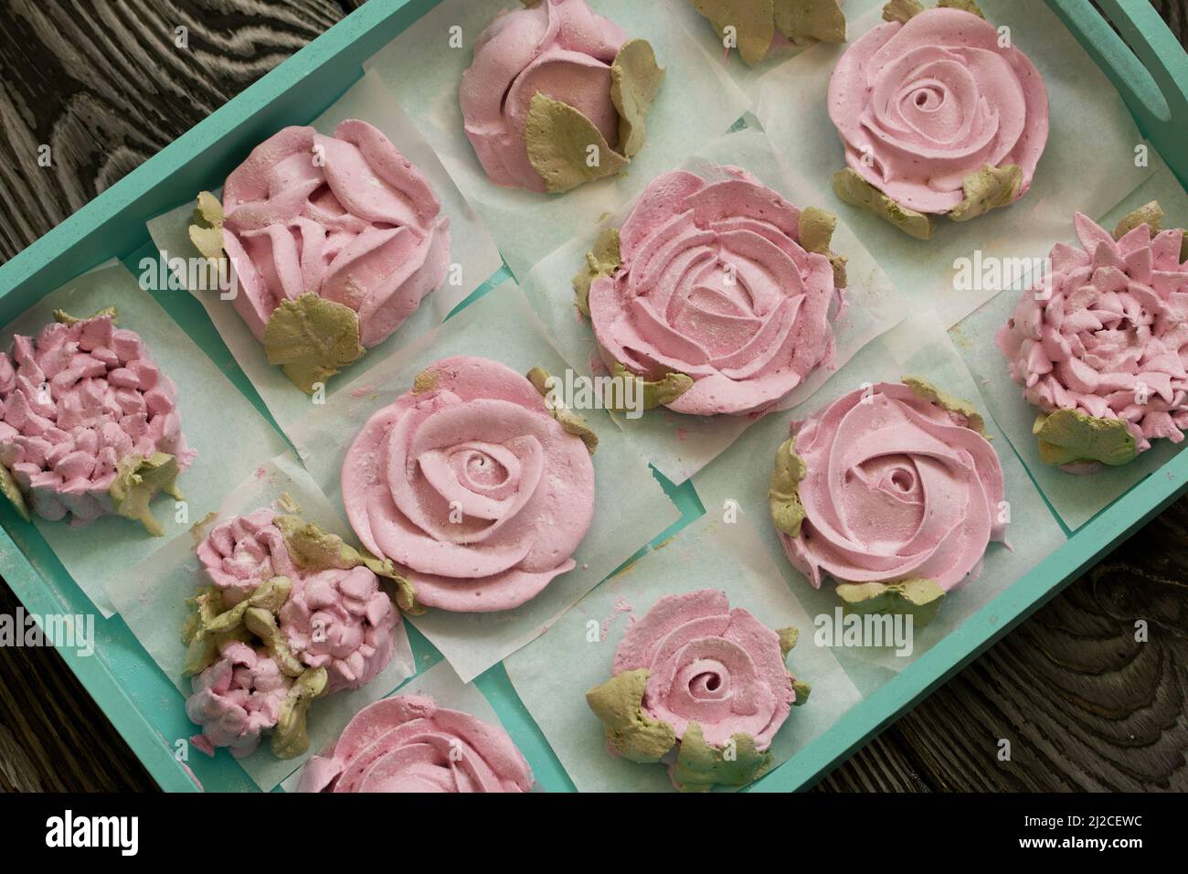 Homemade marshmallows of different shapes and colors. Zephyr flowers