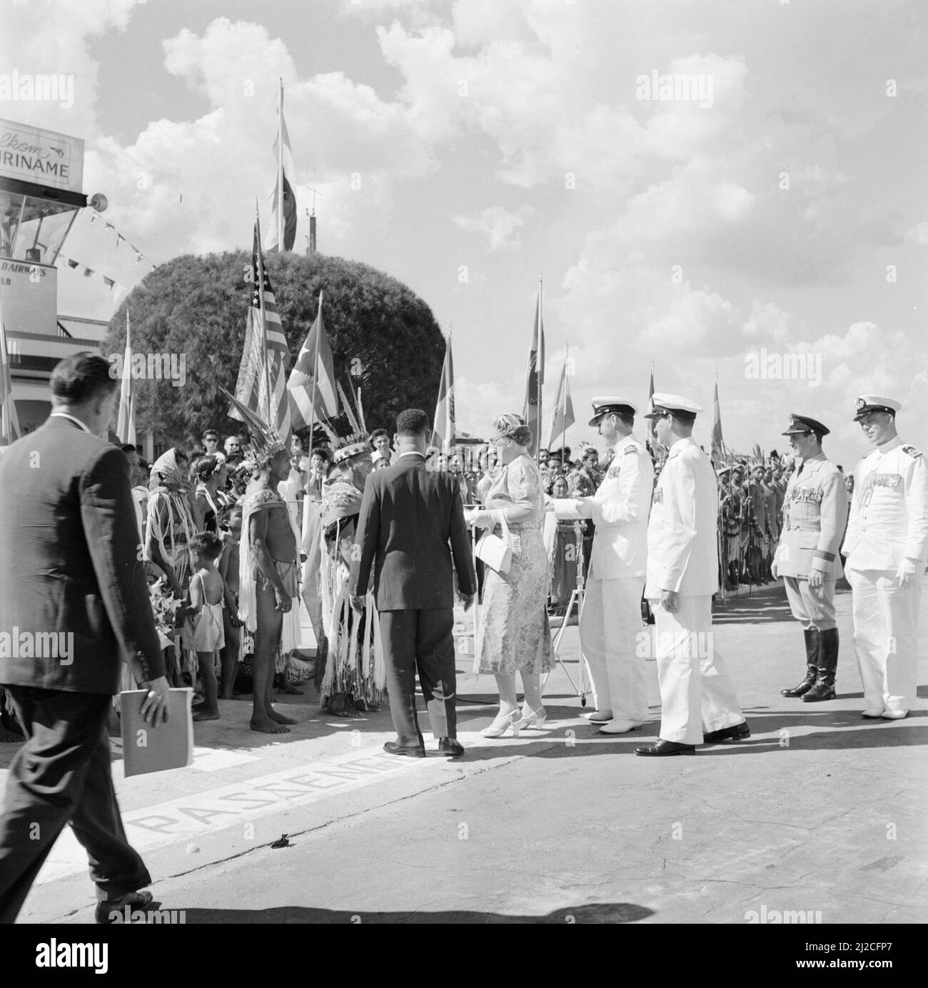 Arrival of Queen and Prince at Zanderij Airport. Greeting by Indians. In the middle Johan Ferrier, President of the Council of Ministers ca: October 27, 1955 Stock Photo