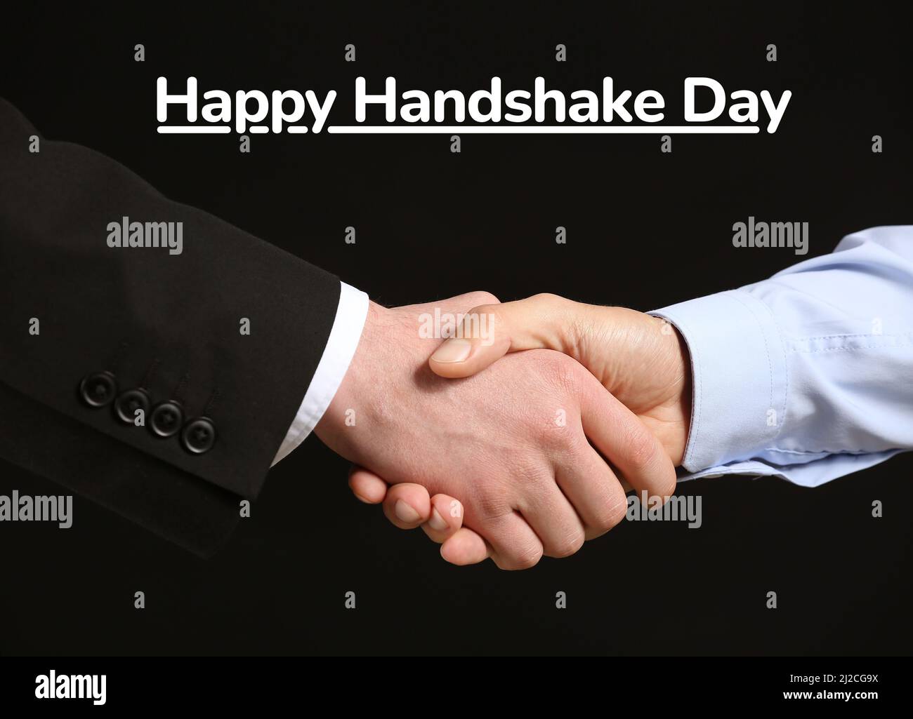 Businessmen shaking hands on black background. Happy Handshake Day