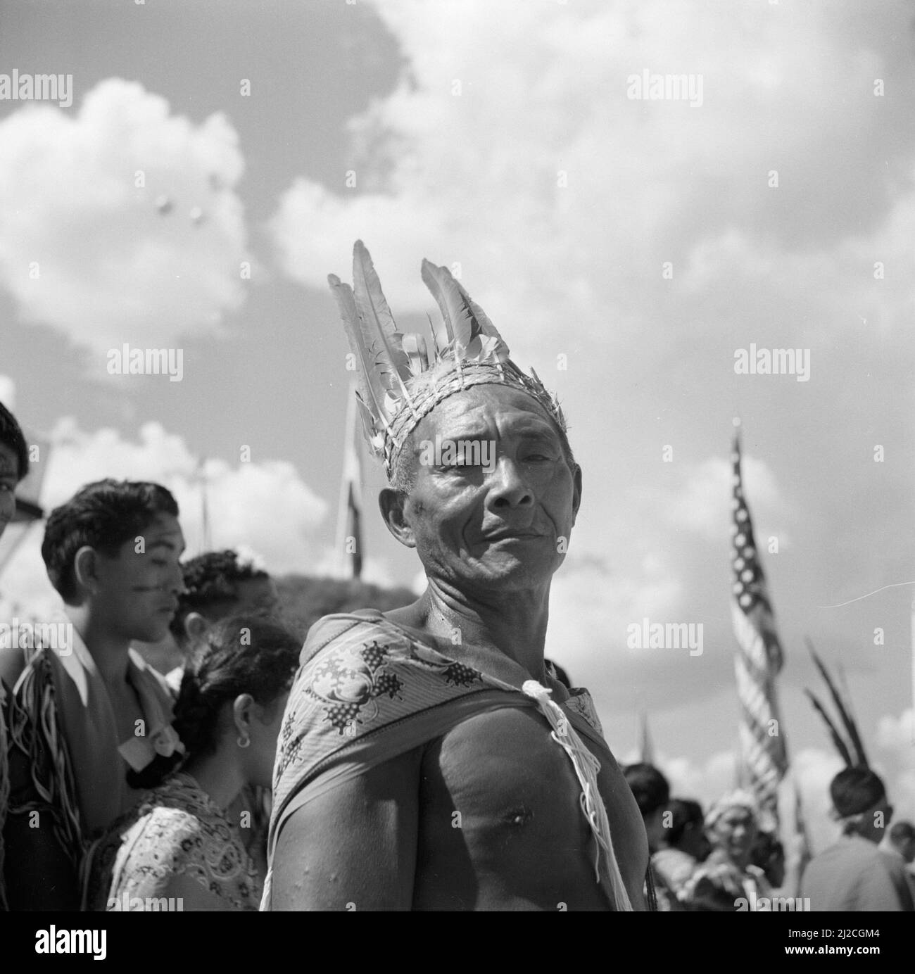 Indian at the arrival of the royal couple at Zanderij airport ca: October 27, 1955 Stock Photo