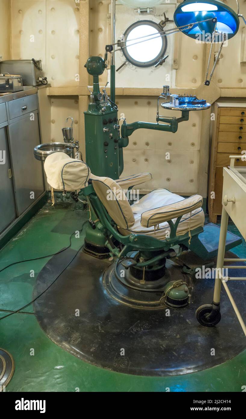 Vintage dentist's chair in British warship HMS Belfast Stock Photo Alamy