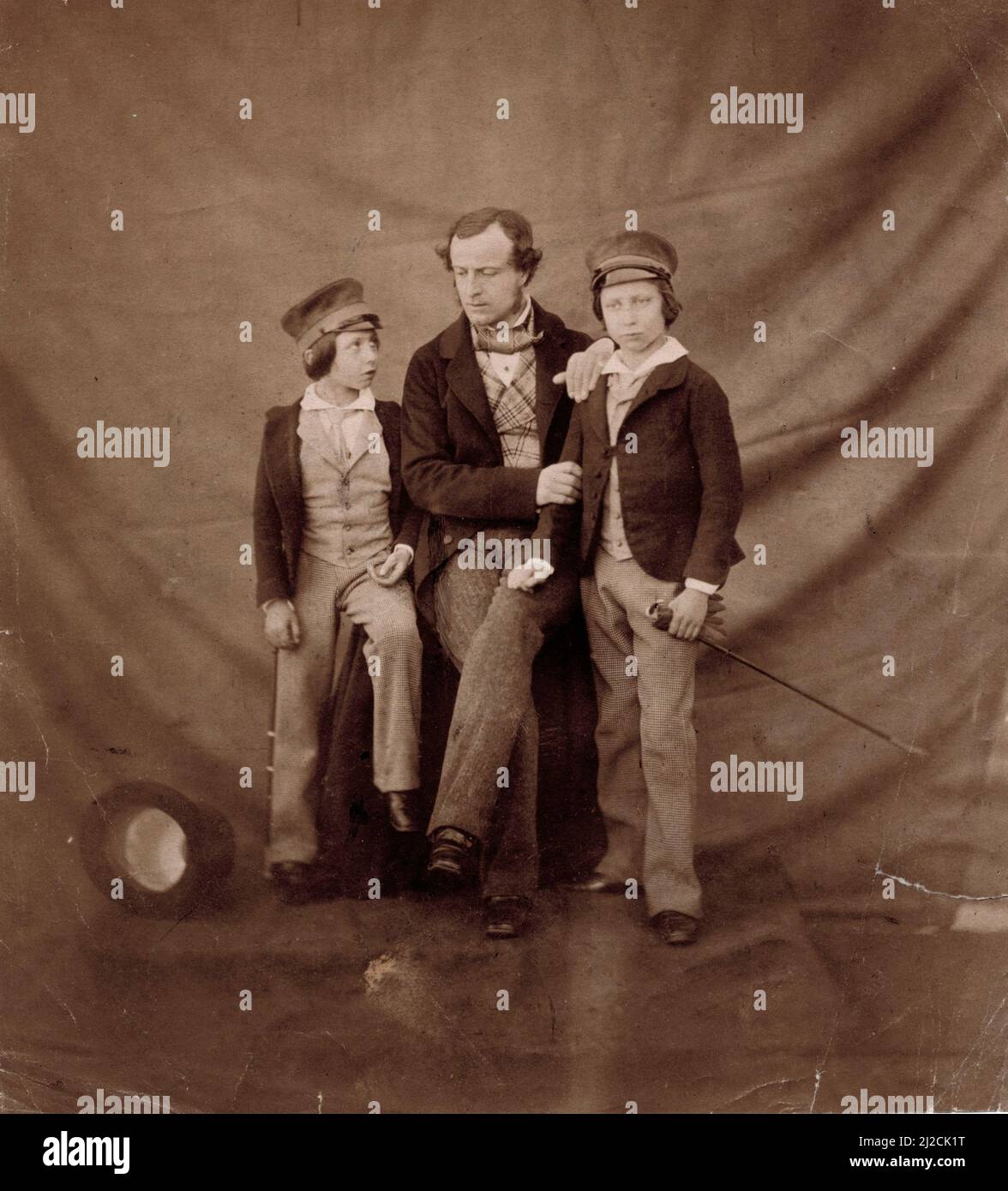 Group portrait of Prince Alfred (Alfred Earnest Albert) (1844 - 1900) (left), the Prince of Wales (Albert Edward) (1841 - 1910) (right) and their tutor, Frederick Waymouth Gibbs (1821 - 1898) (center), February 8, 1854. Photography by Roger Fenton (1819 - 1869). Stock Photo