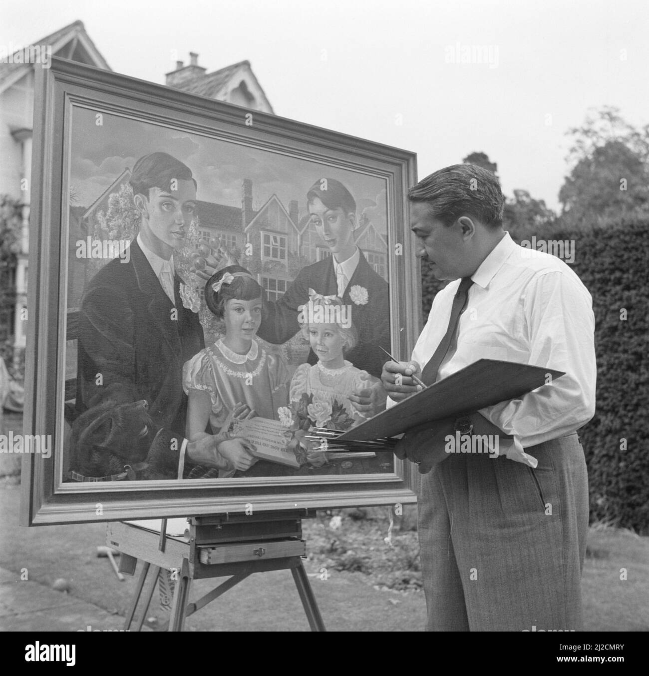 The artist Eppo Doeve with the portrait of the children of the Martineau family, Old Lodge in Terlow (Buckinghamshire)  ca: July 1954 Stock Photo