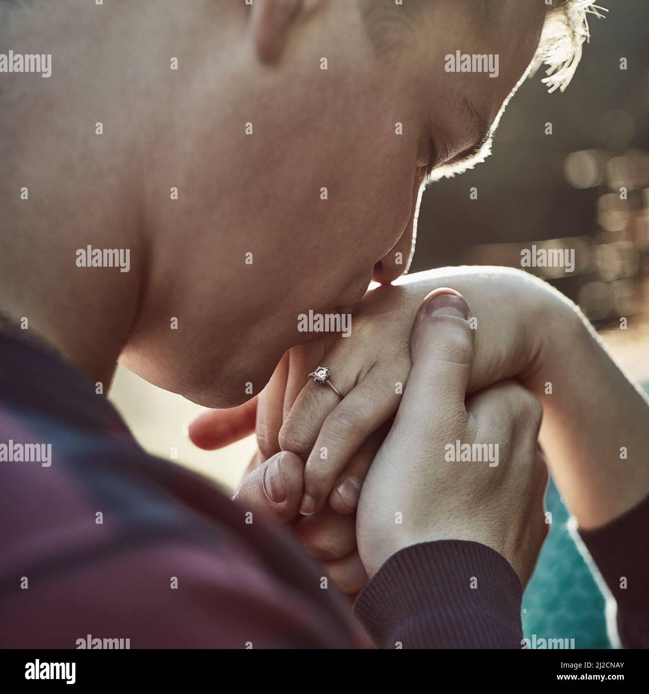 Give Me Your Hand And Ill Never Let Go Shot Of A Young Man Affectionately Kissing His Girlfriends Hand Outdoors Stock Photo Alamy