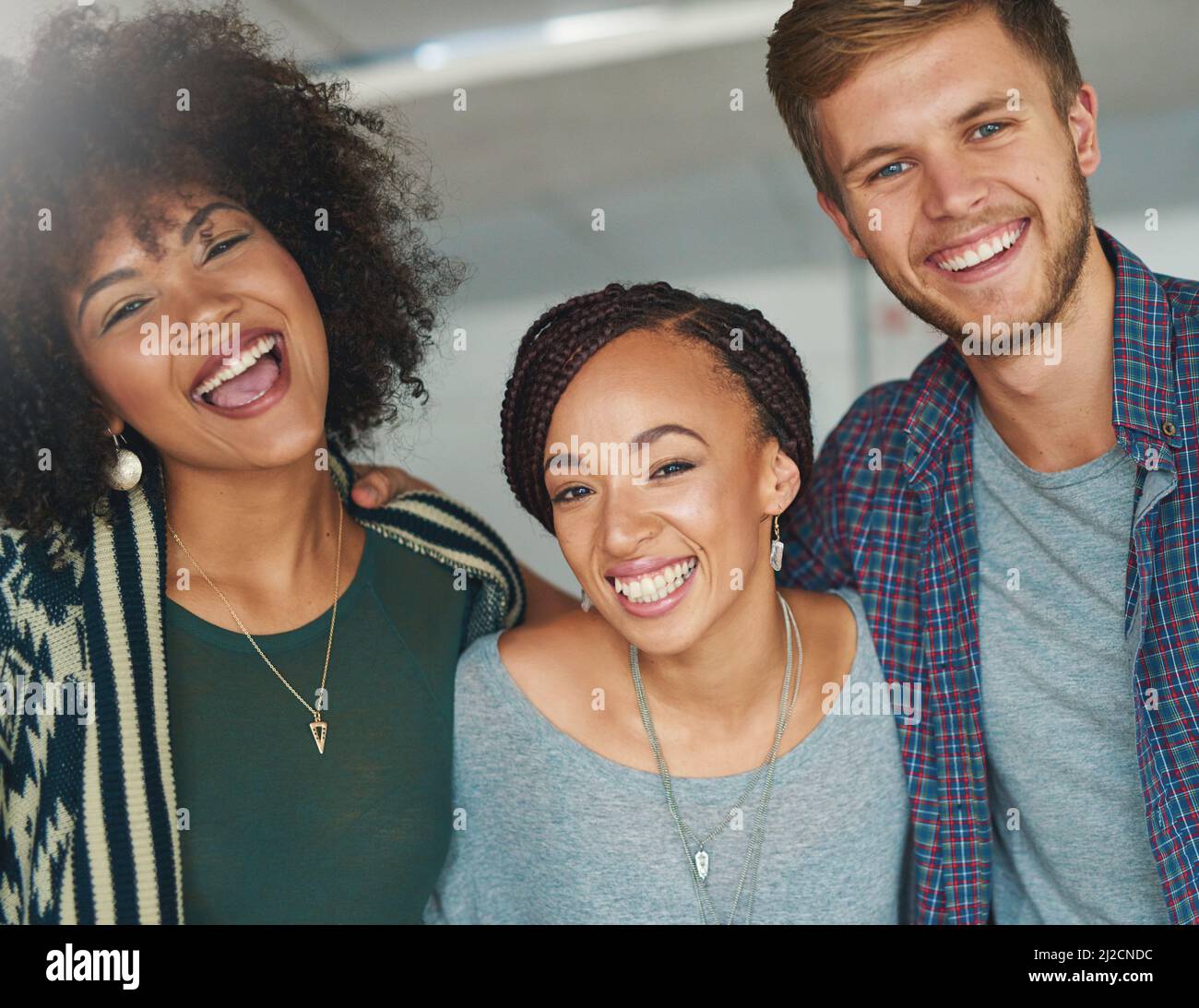 We like to keep things vibrant and fun at work. Portrait of a group of happy and successful young colleagues in a modern office. Stock Photo