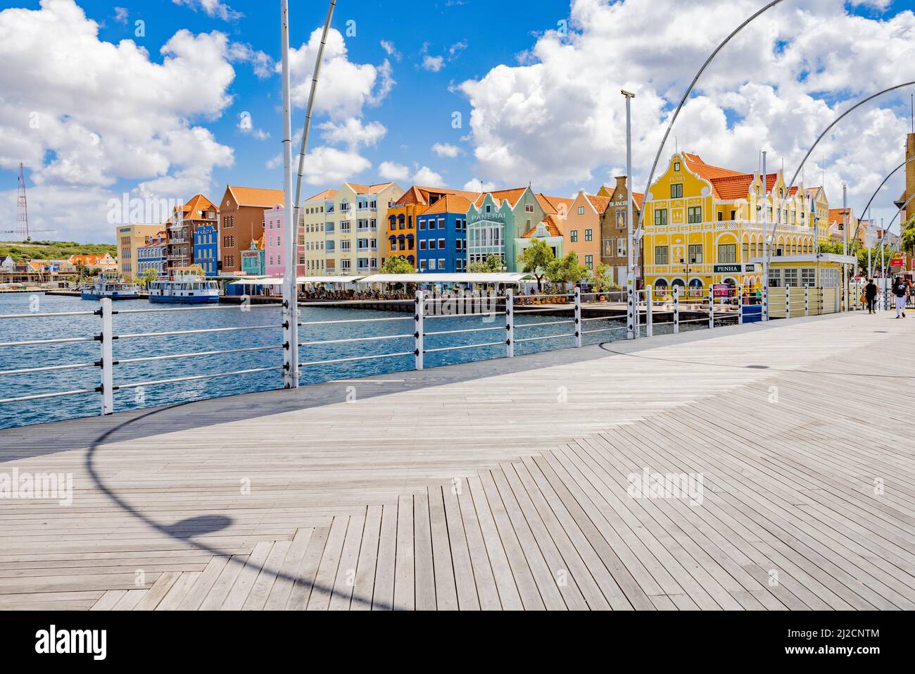 Famous colorful waterfront buildings in dutch-caribbean, colonial style viewed from the Queen-Emma-Bridge in Willemstad, Curacao Stock Photo
