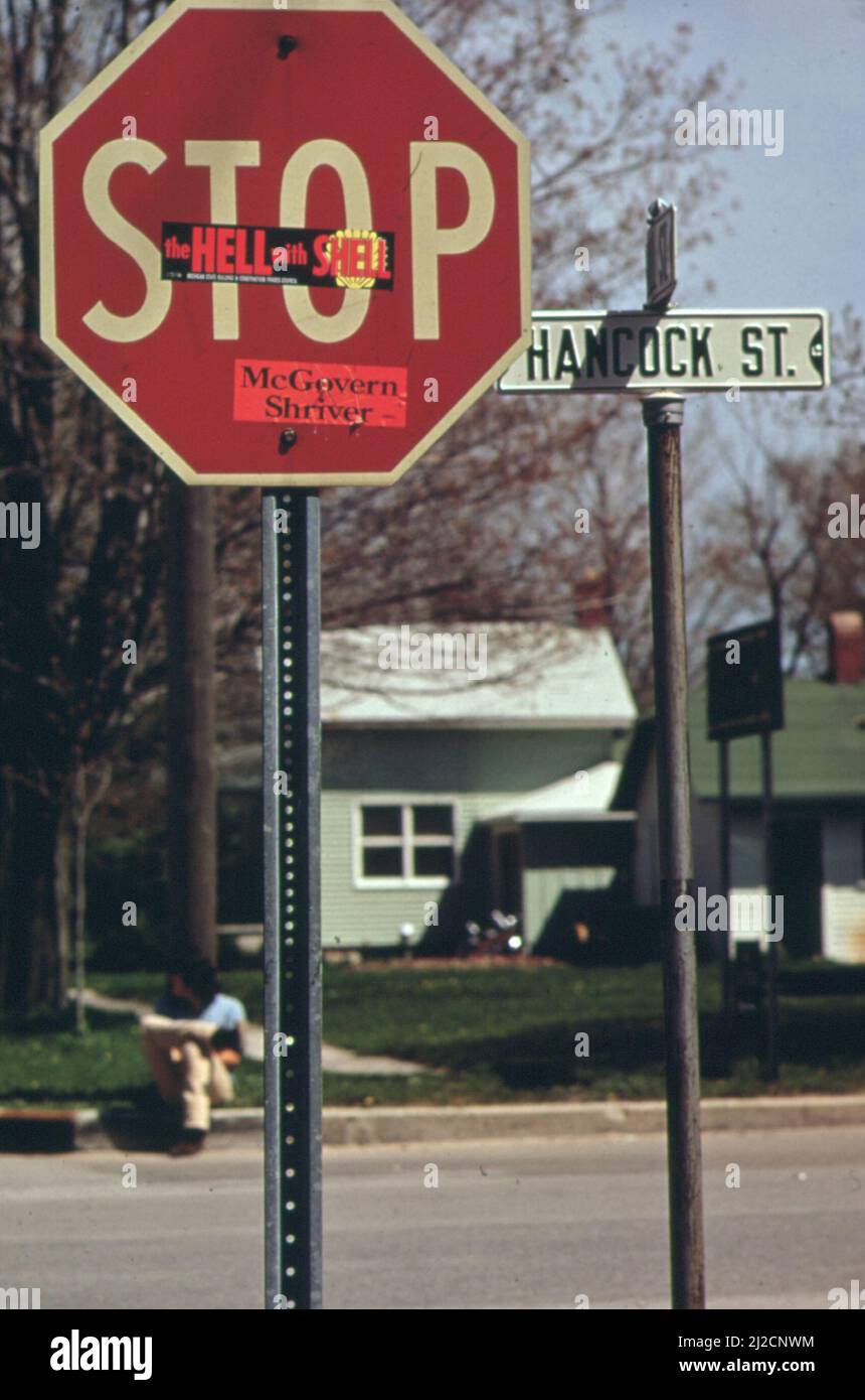 Sticker on stop sign reads, The hell with Shell-in Penwater Michigan ca ...