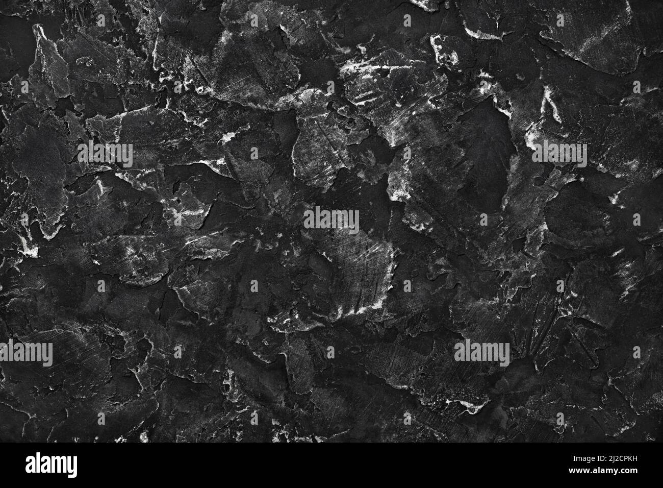 Black plaster background. Black stucco texture. Top view. Flat lay. Stock Photo