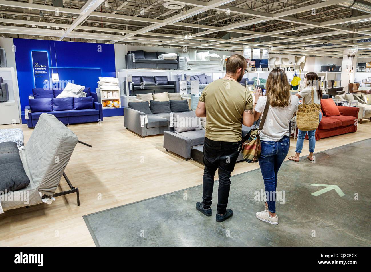Miami Florida IKEA home goods furnishings accessories furniture decor shopping shoppers inside interior display sale couple man woman looking Stock Photo