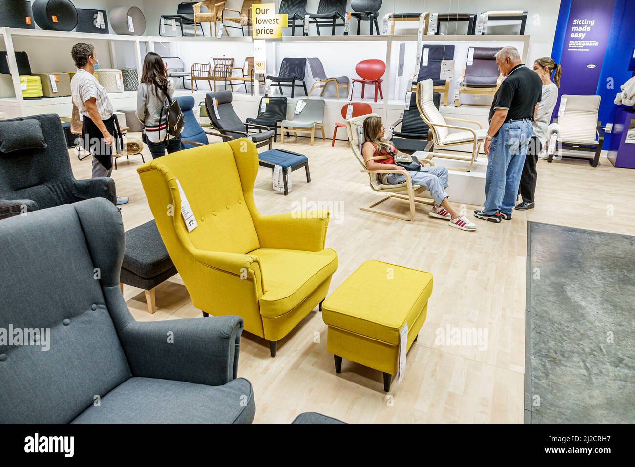 Miami Florida IKEA home goods furnishings accessories furniture decor shopping shoppers inside interior display sale chairs family looking trying Stock Photo