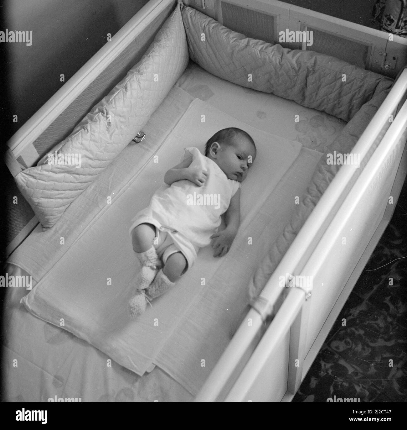 Baby sleeping crib Black and White Stock Photos & Images Alamy