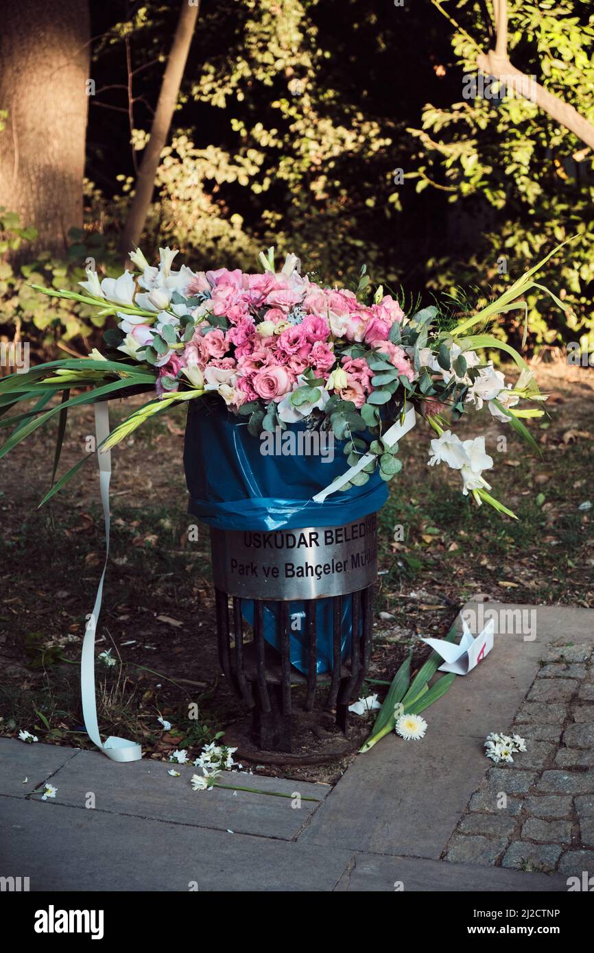 Bouquet of Flowers Sticking Out from a Trash Container Stock Image - Image  of throw, away: 34709765