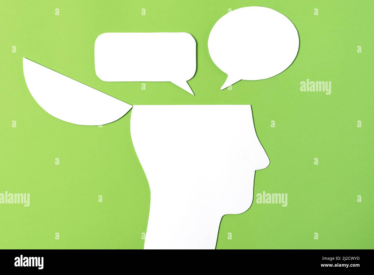 Inner Conflict Concept, Paper Cut out Open head with two speech bubbles Stock Photo