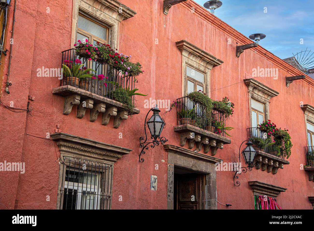 Three and a half balconies showing on a building. San Miguel de Allende, Guanajuato, Mexico. Stock Photo