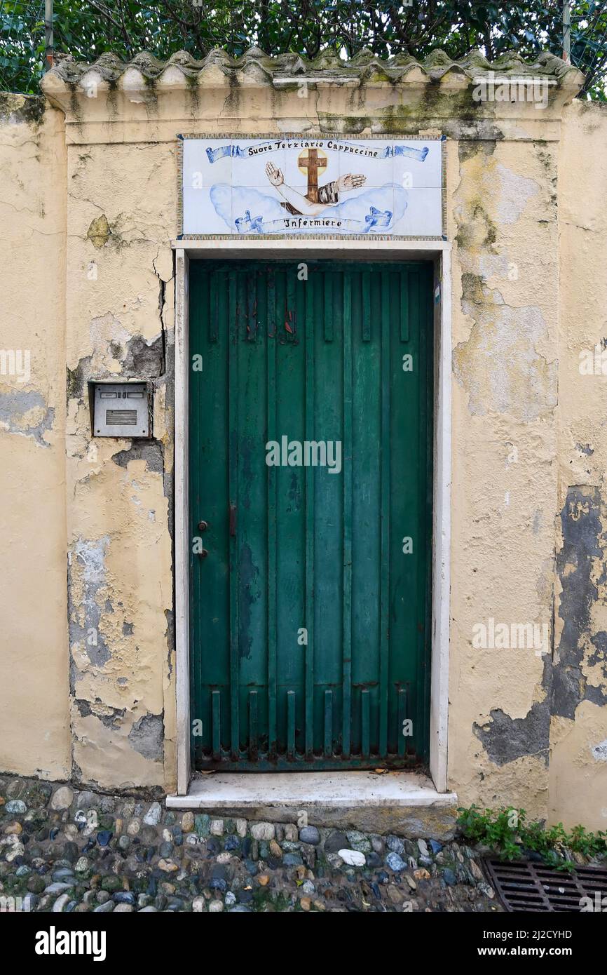 Entrance door of the Capuchin Tertiary Nuns in an alley of the old town, Sanremo, Imperia, Liguria, Italy Stock Photo