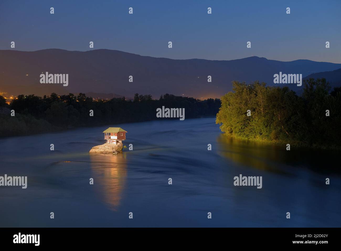 wooden house on a rock of Drina River by night, Serbia Stock Photo