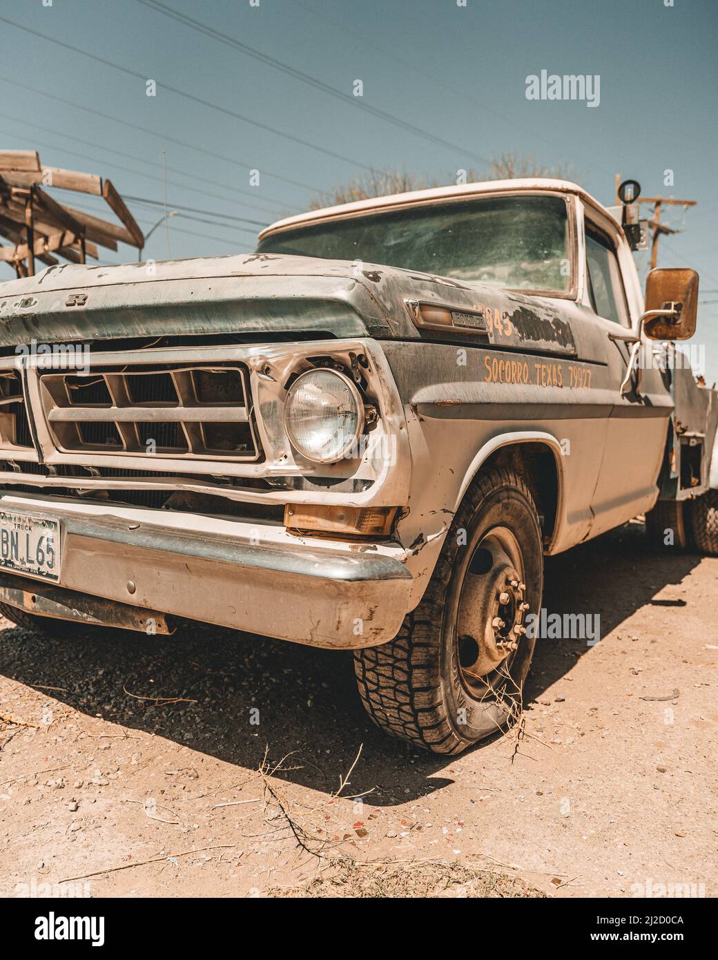 A vertical shot of a rusty old Ford Truck on a sunny day Stock Photo