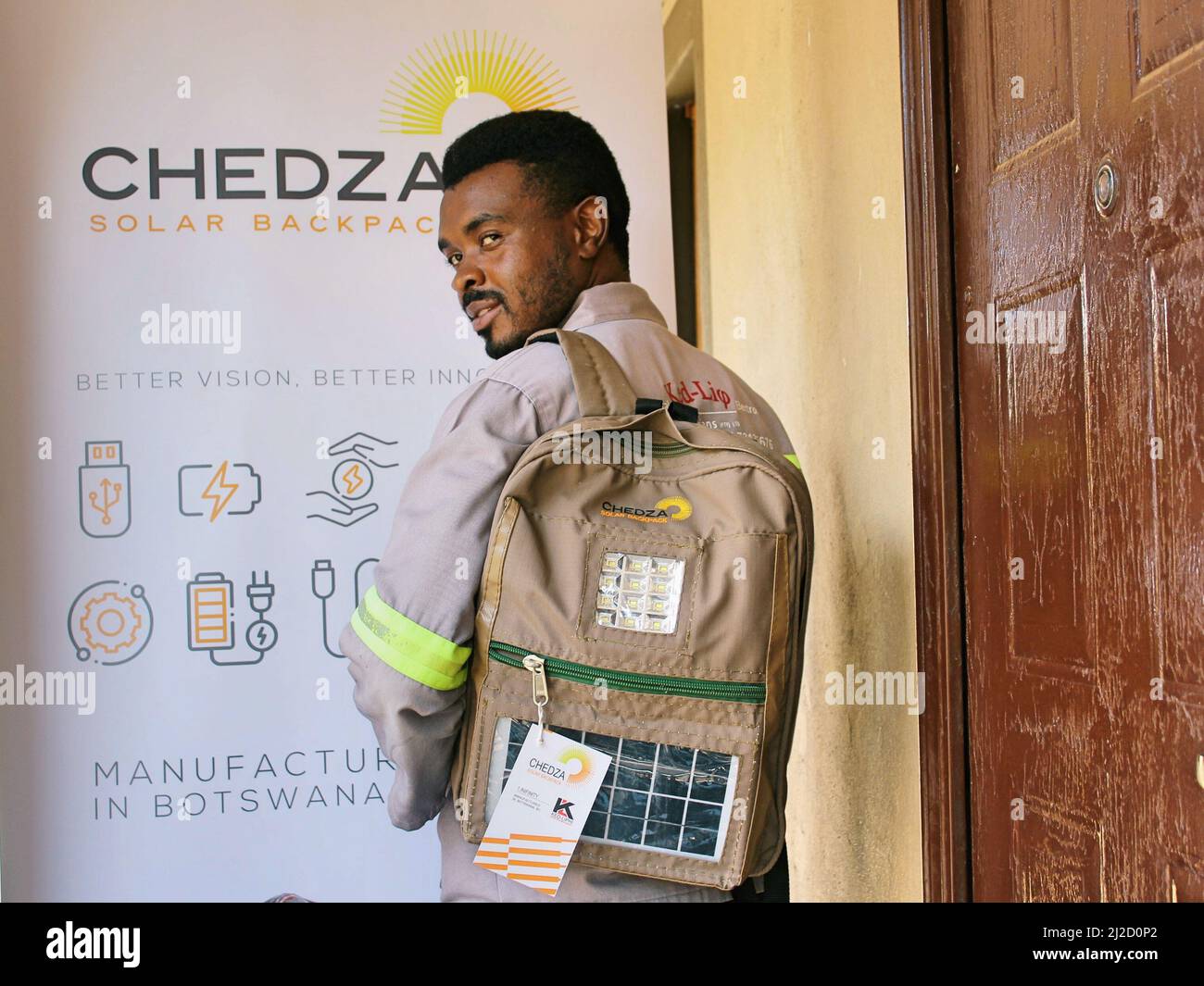 Gaborone, Botswana. 21st Mar, 2022. Kedumetse Liphi, the 31-year-old innovative creator of Chedza Solar Backpacks, shows a solar backpack in Gaborone, Botswana, on March 21, 2022. In the first week of April, disadvantaged children in Botswana villages such as Tshono, Mokhomba, Lefoko and Sevrelela will receive Chedza Solar Backpacks that will enable them to study at night. Credit: Sharon Tshipa/Xinhua/Alamy Live News Stock Photo
