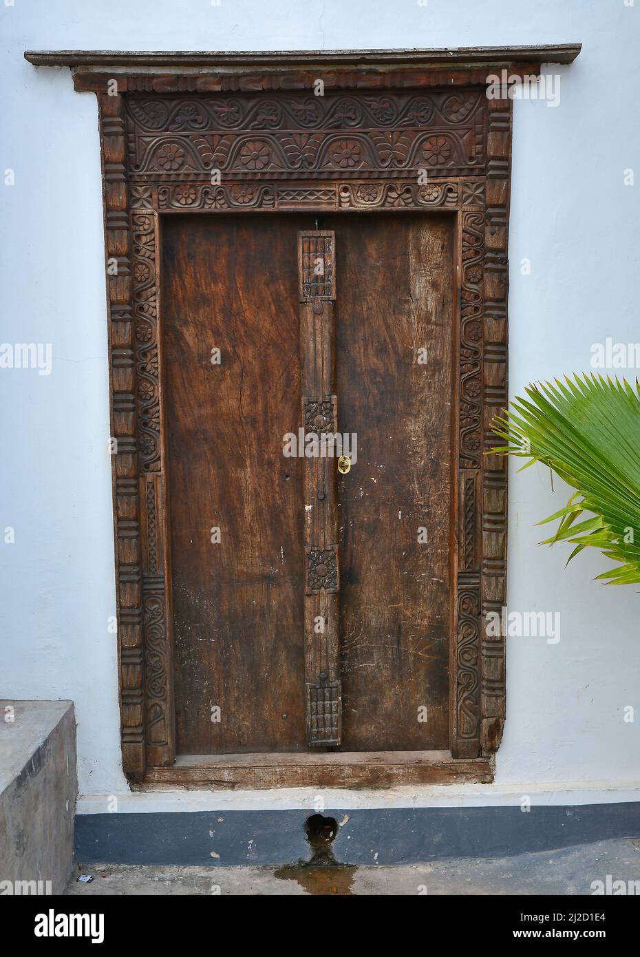 Rustic wooden doors with traditional carvings in Zanzibar, Tanzania