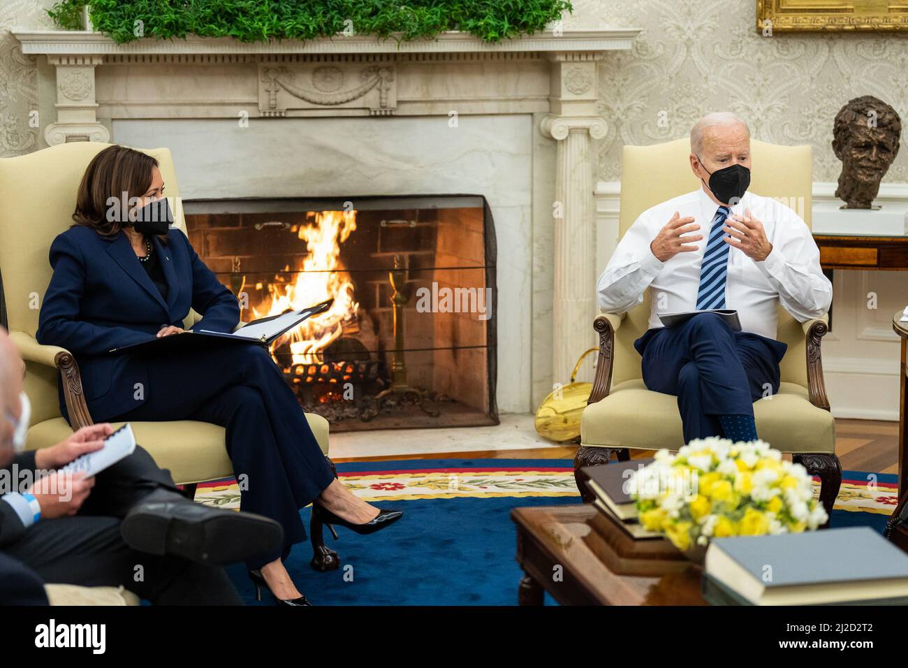 President Joe Biden and Vice President Kamala Harris meet with cabinet members and staff for a report of the Task Force on Worker Organizing and Empowerment, Friday, February 4, 2022, in the Oval Office of the White House. Stock Photo