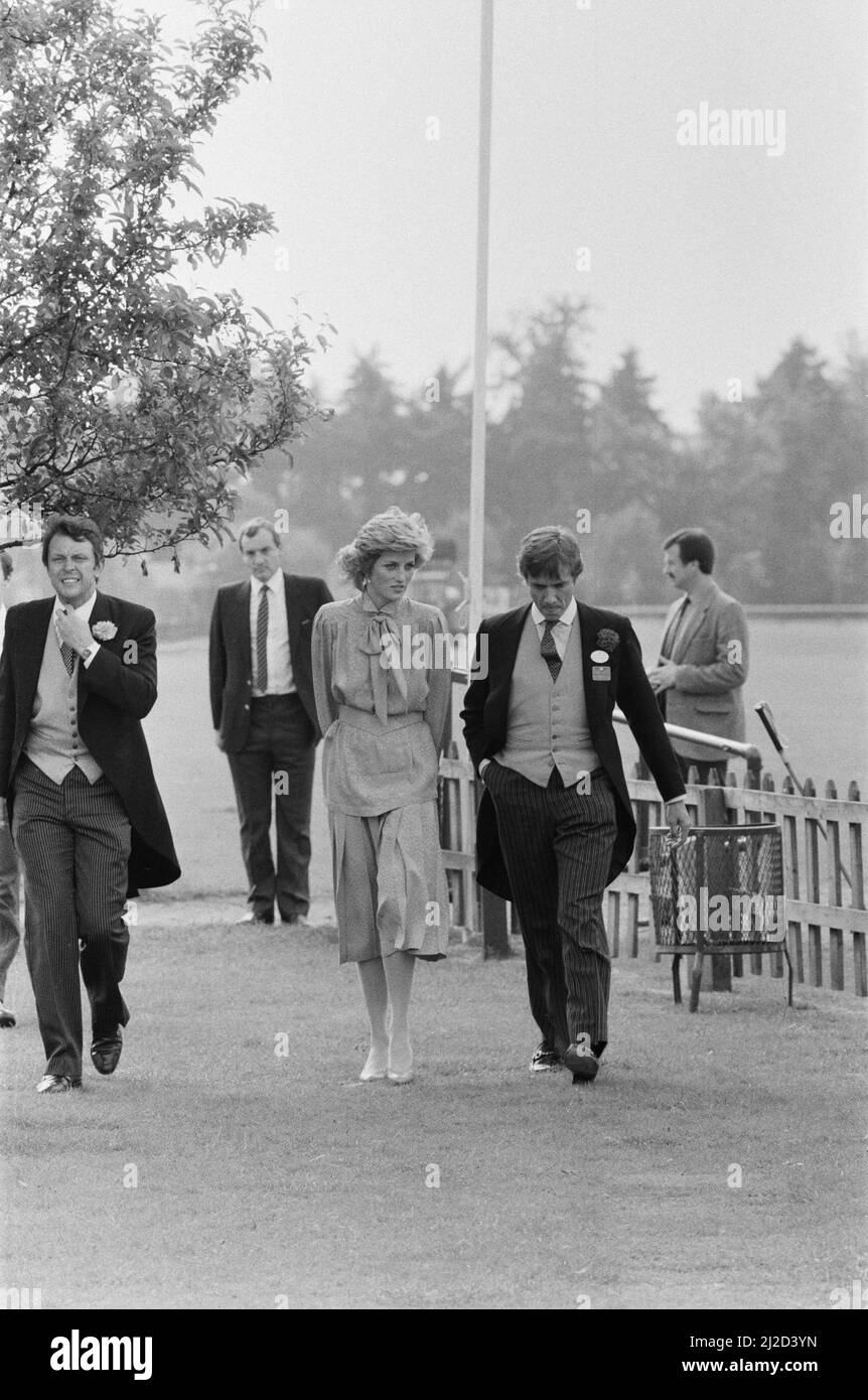 HRH Princess Diana, The Princess of Wales, at Guards Polo at Windsor, Berkshire. Seen behind the Princess, 2nd from the left in this picture and in line with the tree, walking along is Barry Mannakee, Princess Diana's bodyguard.   Picture taken 20th June 1985 Stock Photo