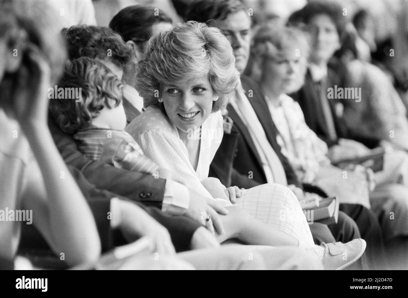 Live Aid dual venue benefit concert held on 13th July 1985 at Wembley Stadium in London, England, and the John F. Kennedy Stadium in Philadelphia, Pennsylvania, United States. The concerts were organised as a follow up to the Band Aid single 'Do They Know Its Christmas?'  to raise money for victims of the famine in Ethiopia. Picture shows  Princess Diana, Princess of Wales watching the performance during the concert at Wembley. Stock Photo