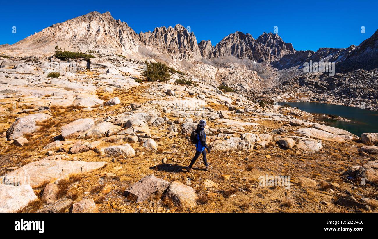 Hiker in Dusy Basin under the Palisades, Kings Canyon National Park, California USA Stock Photo