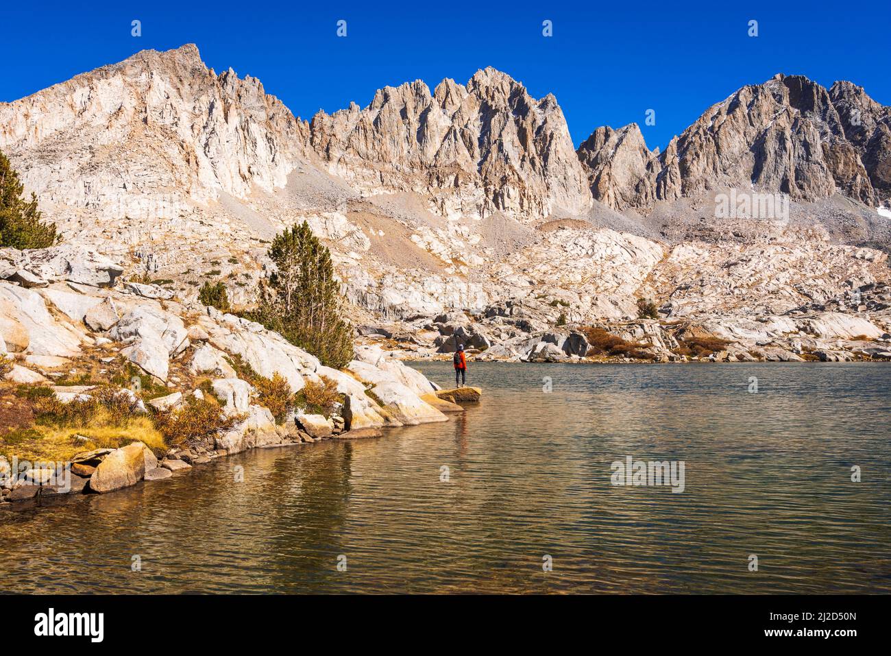 Hiker in Dusy Basin under the Palisades, Kings Canyon National Park, California USA Stock Photo