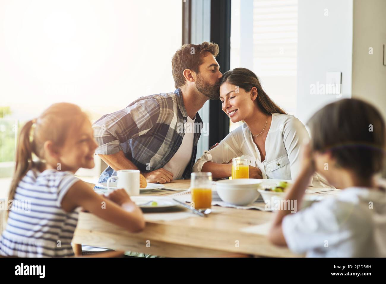 Their home is filled with love and happiness. Shot of a family having breakfast together at home. Stock Photo