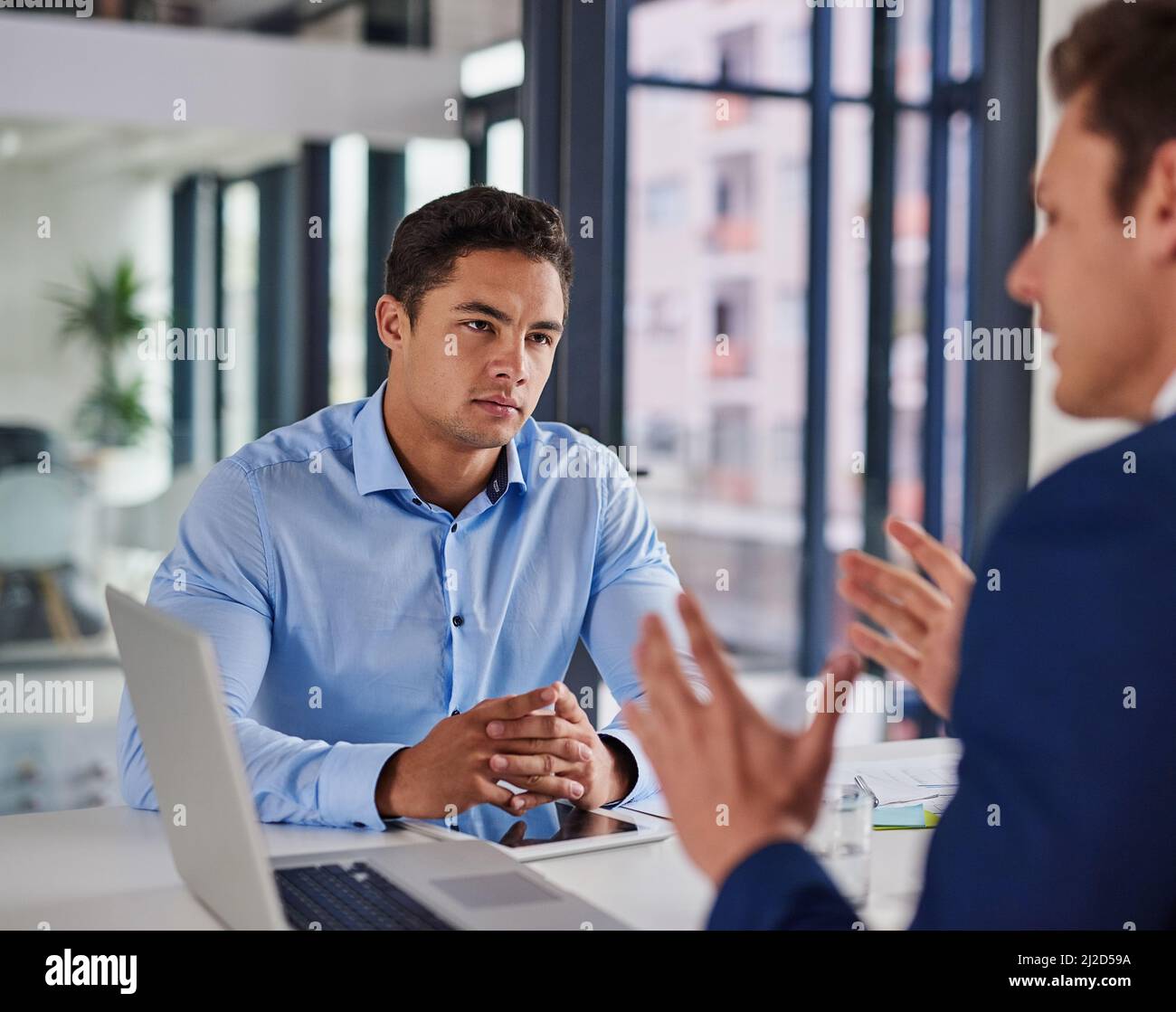 Focused on getting some serious business done. Shot of two businessmen ...