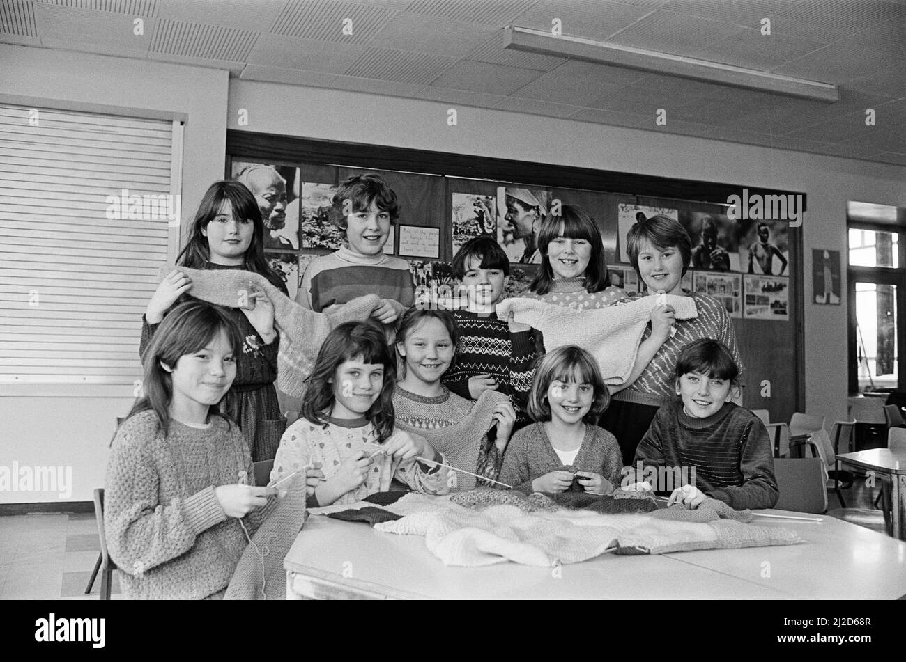 Knitting jumpers, cardigans and blankets for refugee camps in Ethiopia and Sudan are Lowerhouses Junior School pupils. Twenty children are involved in the charity knit. 13th February 1985. Stock Photo