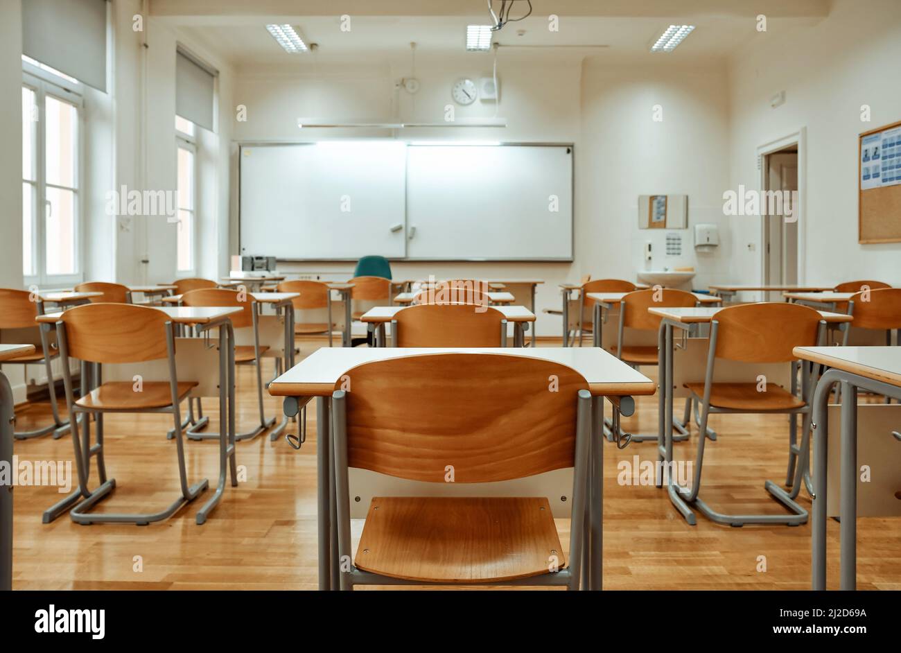 A whiteboard on the wall of an empty classroom Stock Photo Alamy