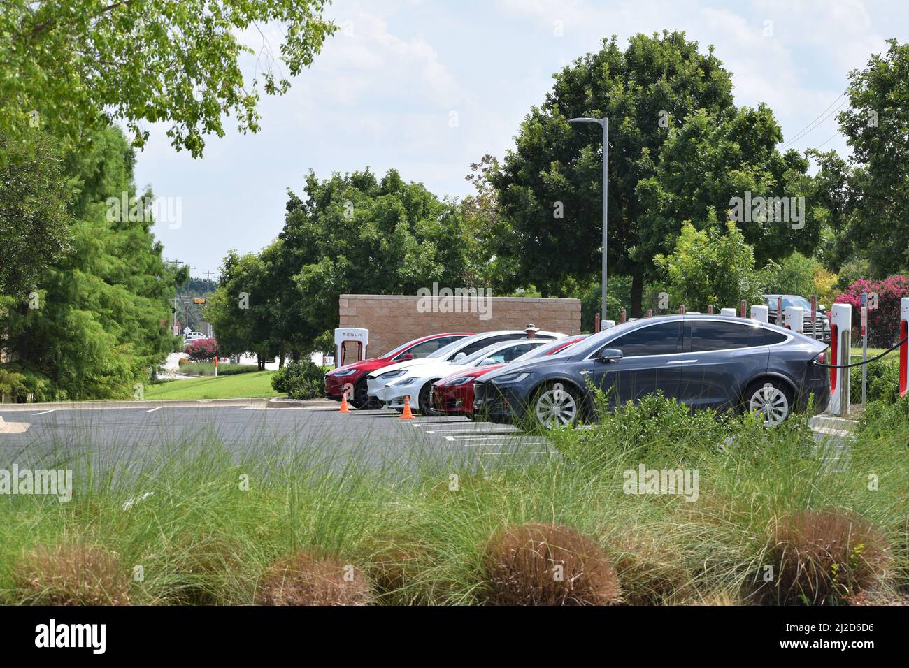Tesla vehicles being charged at a Tesla charging station in Southlake ...
