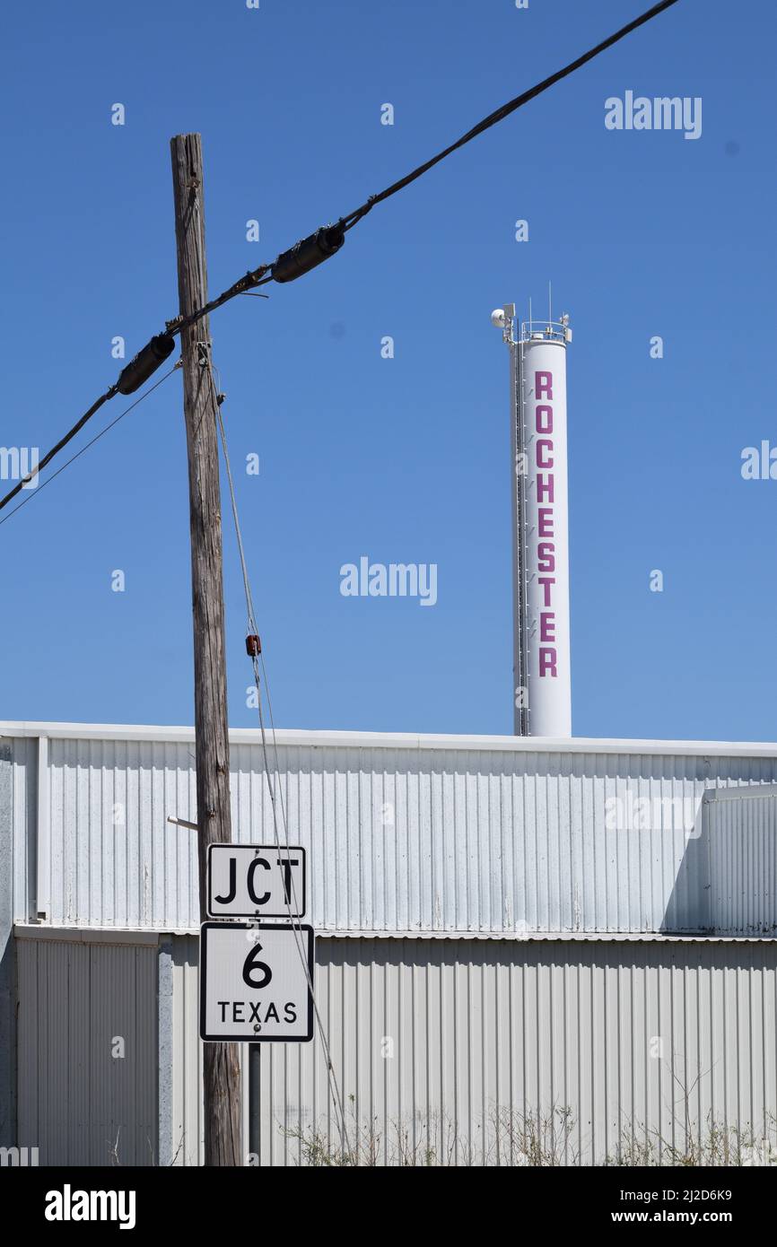 Small water tower and Texas State Highway 6 sign in Rochester Texas - August 2021 Stock Photo