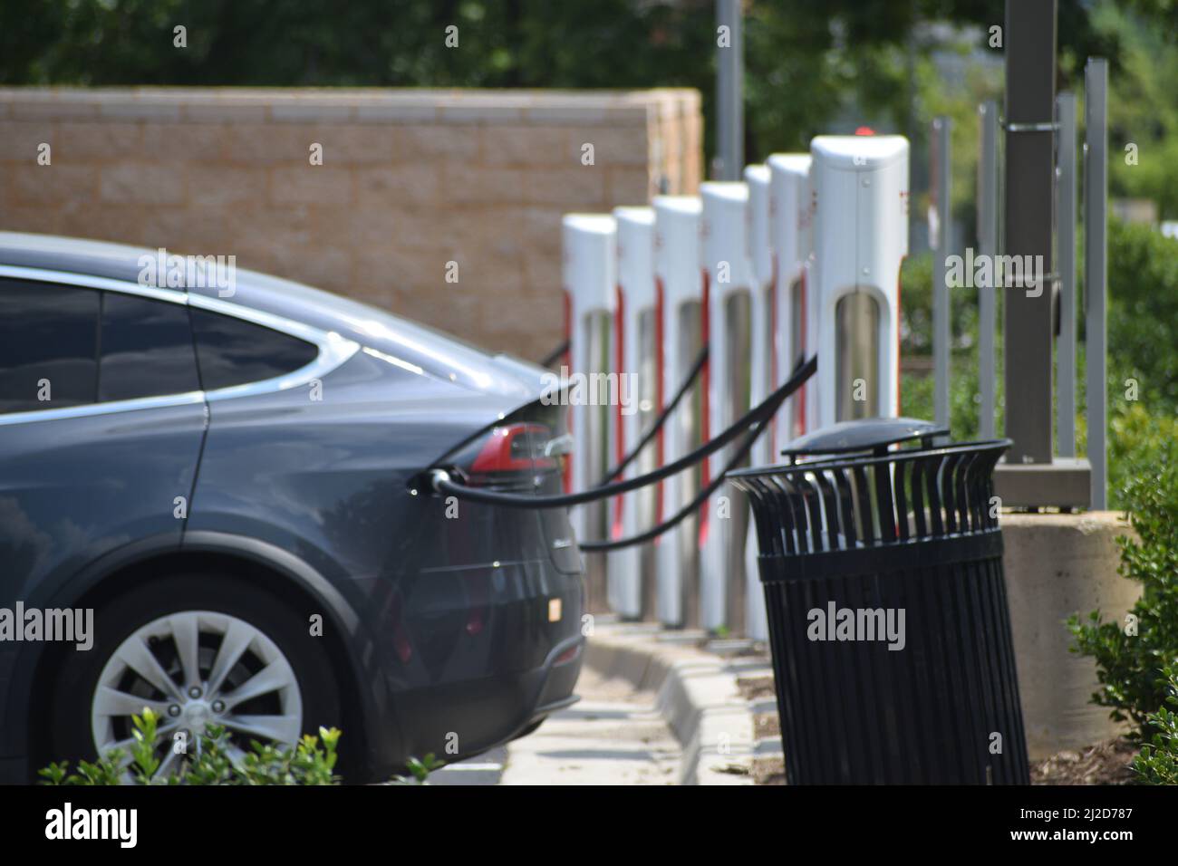 Tesla vehicles being charged at a Tesla charging station in Southlake Texas - July 2021 Stock Photo
