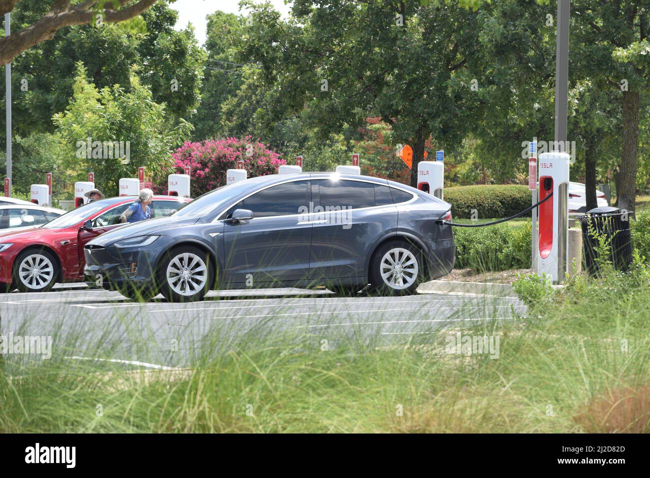 Tesla vehicles being charged at a Tesla charging station in Southlake ...