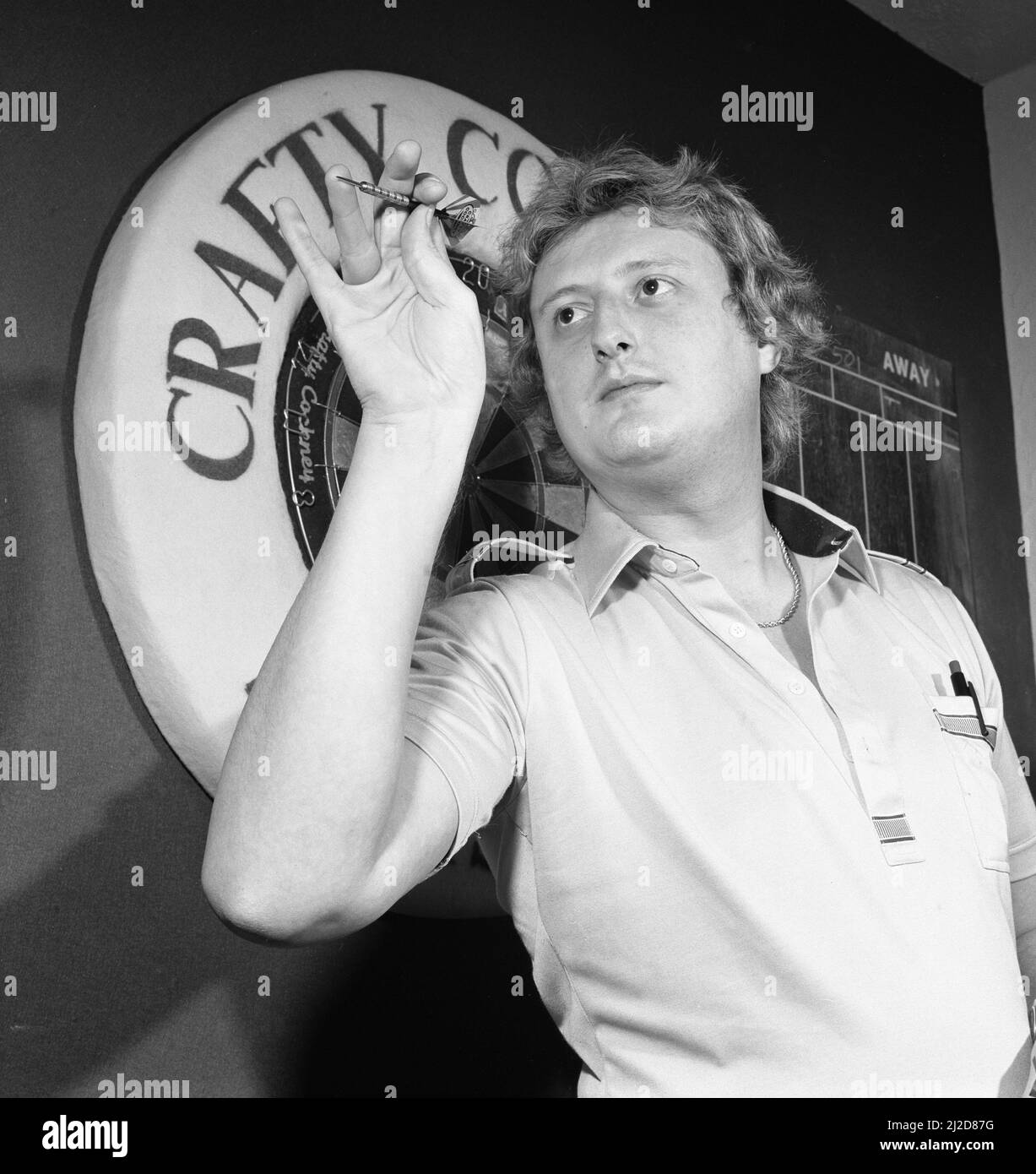 Close up feature on British darts player Eric Bristow in dart throwing