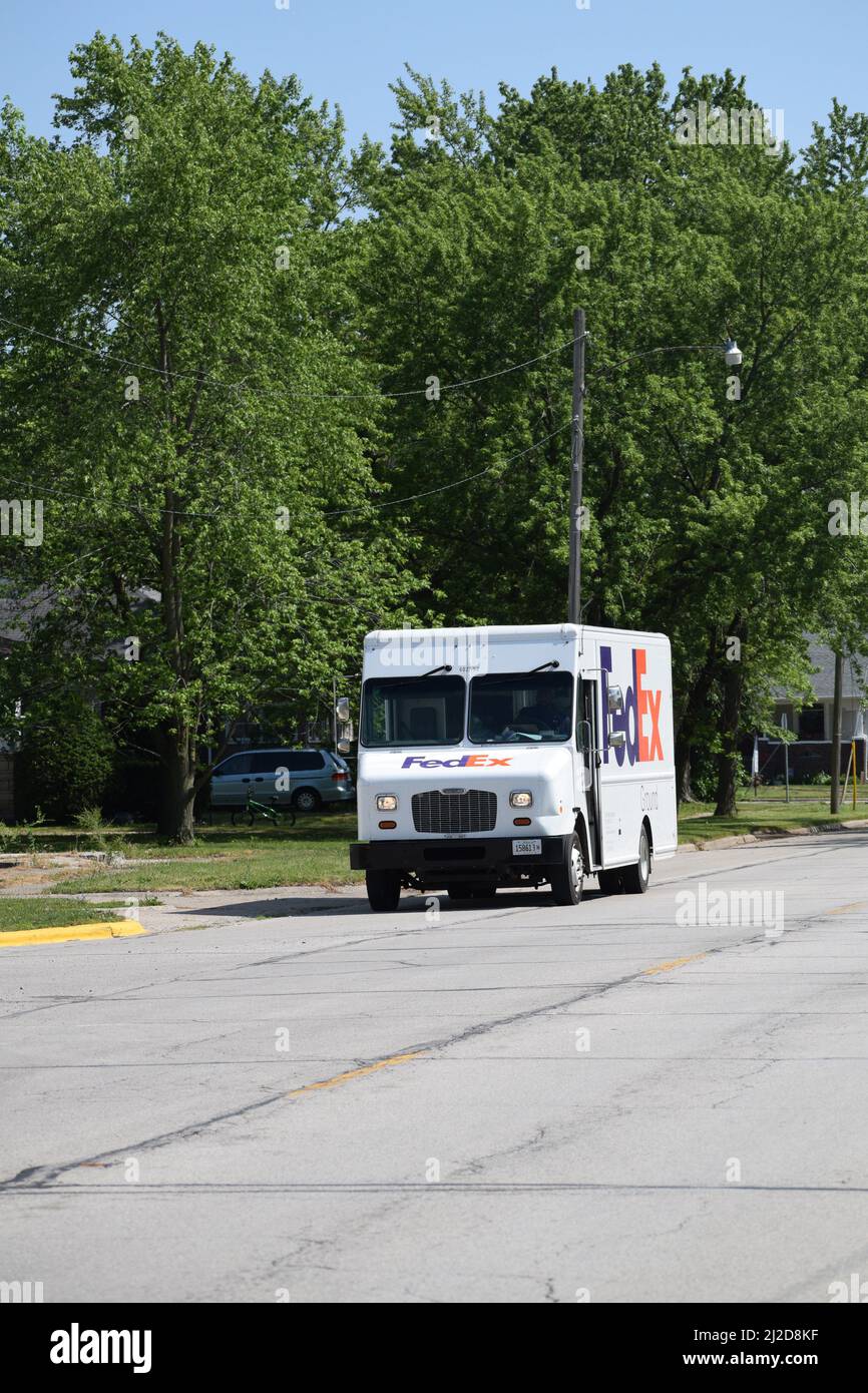 A FedEx delivery truck driving north on Illinois Route 49 in the small town of Rankin, Illinois Stock Photo