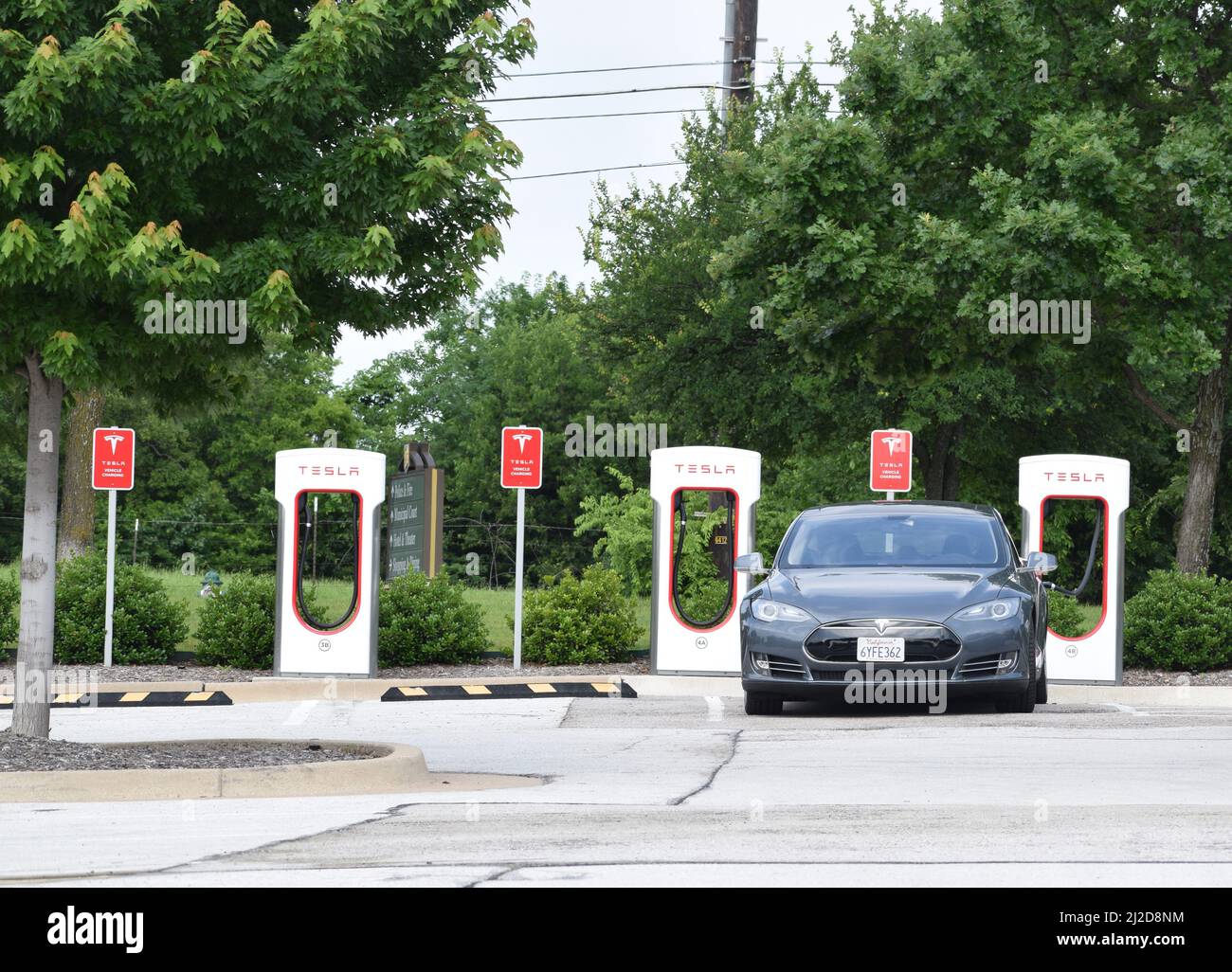 A Tesla electric car parked at a Tesla charging station in Southlake, TX Stock Photo