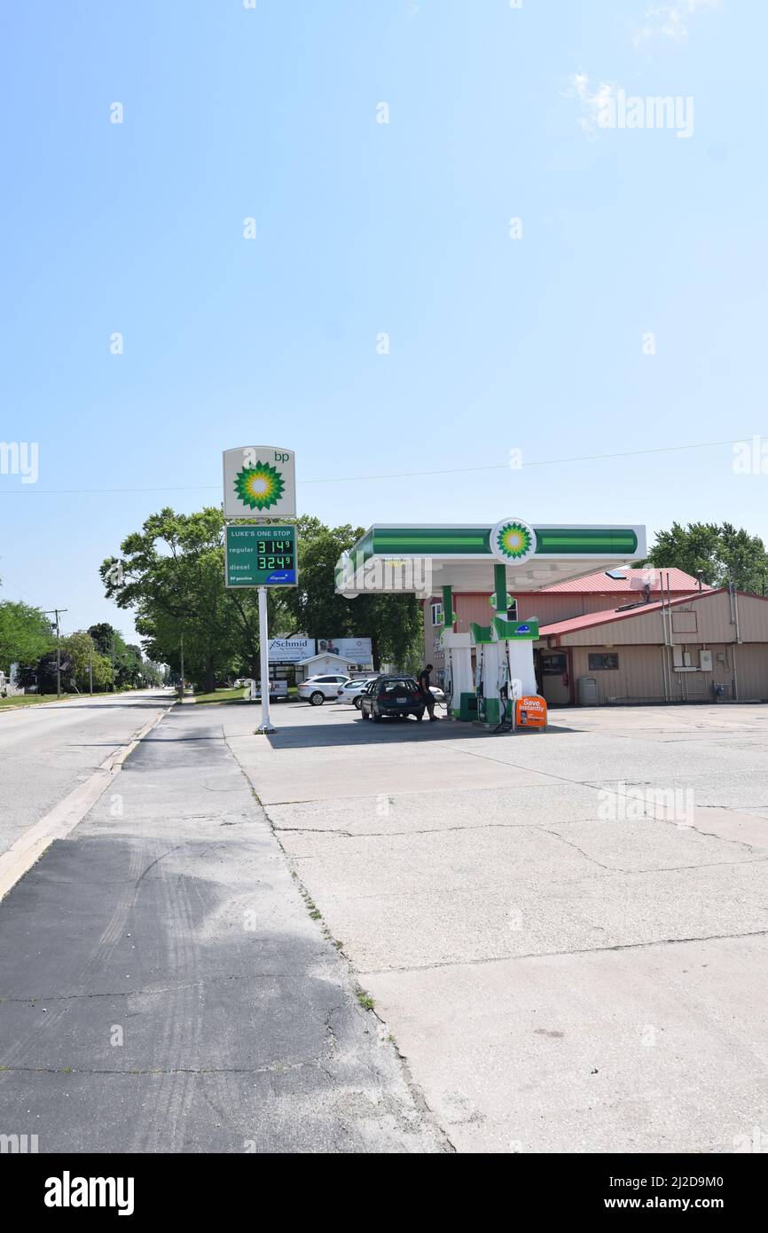 Customers pumping gas at the BP gas station in Cissna Park, Illinois