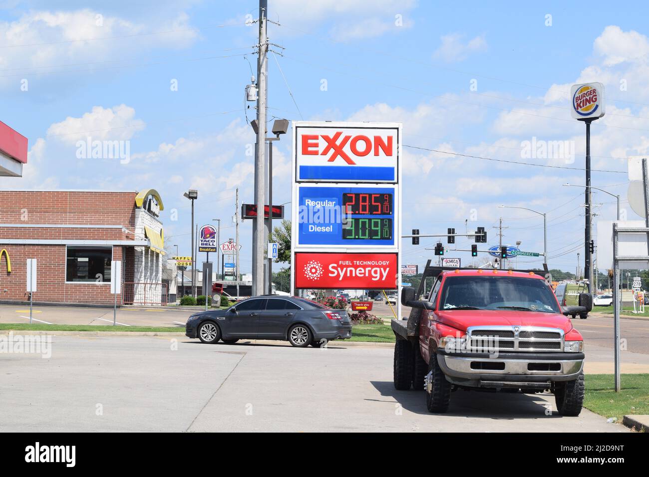Hope Arkansas Businesses along Hervey Street; Red pickup truck parked next to an Exxon gas