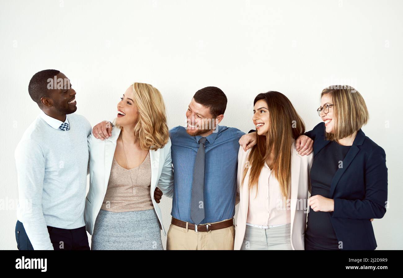 This bunch are real close. Studio shot of a group of work colleagues ...