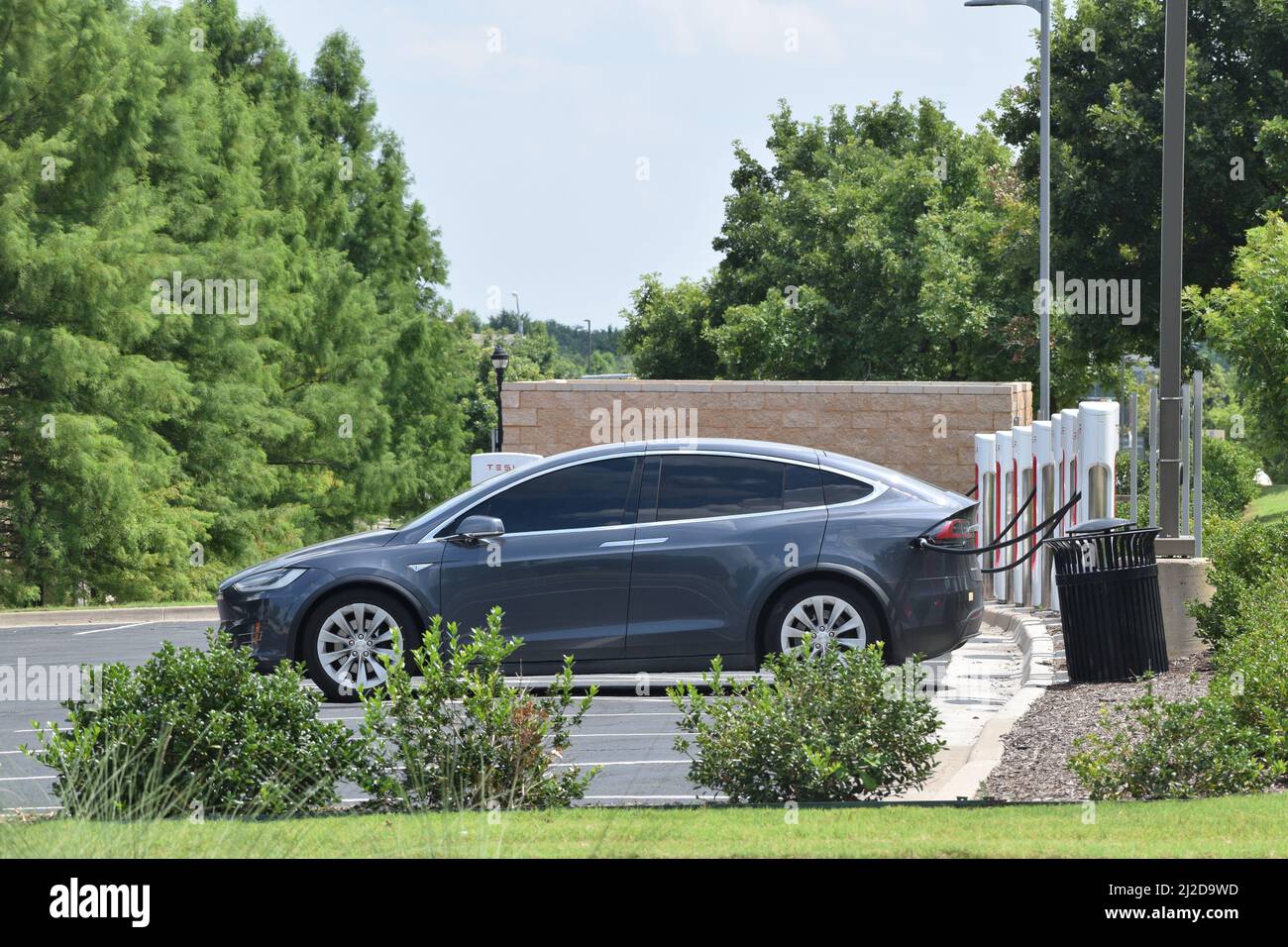 Tesla vehicles being charged at a Tesla charging station in Southlake ...
