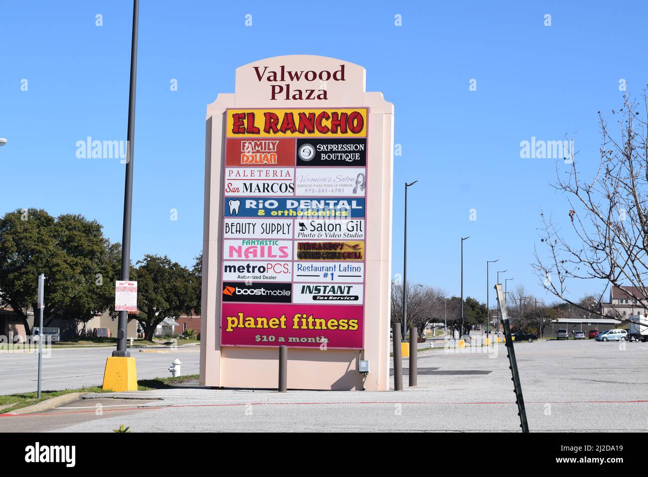 A sign with the names of all stores in Valwood Plaza shopping center in Farmers Branch, TX Stock Photo