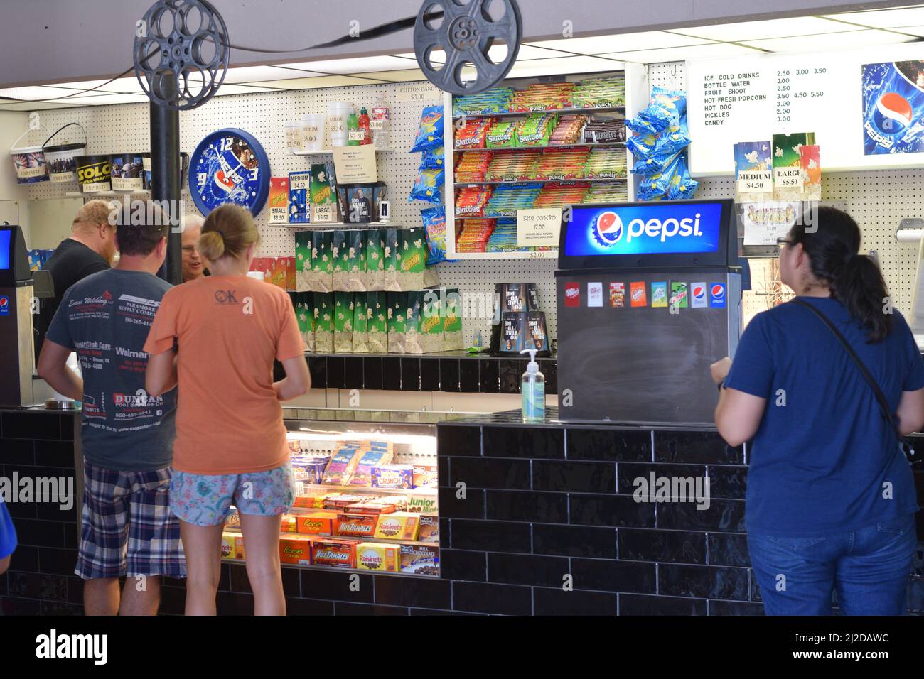 Customers at a movie theater concession stand in Duncan, OK Stock Photo