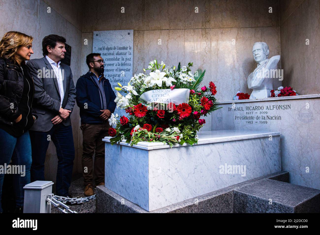 Buenos Aires, Argentina. 30th Mar, 2022. Supporters of the Radical Civic Union (UCR) and followers of former president Raúl Alfonsín show their respect in front of the tomb of the first president after the return to democracy in Argentina in 1983. Tribute to the former president Raúl Alfonsín. The National Committee of the Radical Civic Union (UCR), a political party to which Alfonsín belonged, paid tribute to him at the Recoleta cemetery 13 years after his death. (Photo by Nacho Boullosa/SOPA Images/Sipa USA) Credit: Sipa USA/Alamy Live News Stock Photo