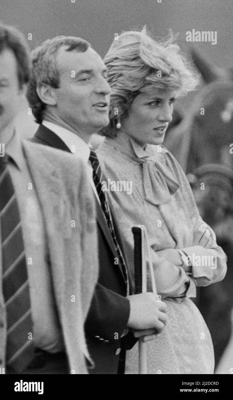 HRH Princess Diana, The Princess of Wales, at Guards Polo at Windsor, Berkshire. Seen standing next to the Princess, to her actual right is Barry Mannakee, Princess Diana's bodyguard.   He is wearing the dark jacket and diagonal striped tie.  Picture taken 20th June 1985 Stock Photo