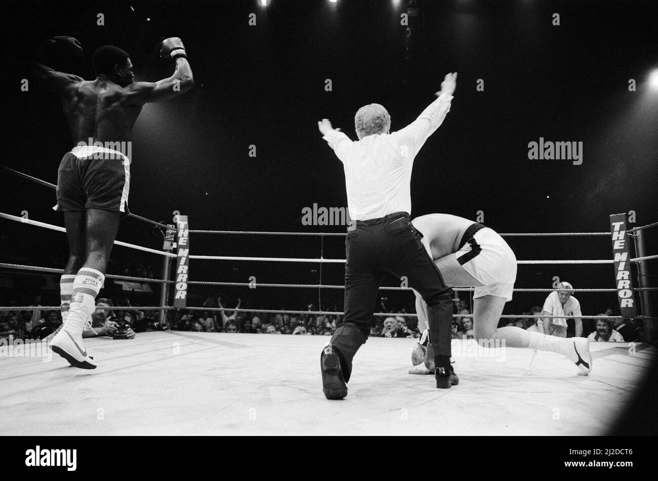 Frank Bruno vs. Anders Eklund for the European Heavyweight Title. Bruno knocked out Eklund in round four.(Picture) Bruno celebrates becoming European Heavyweight Champion as the referee counts Eklund out. 1st October 1985 Stock Photo