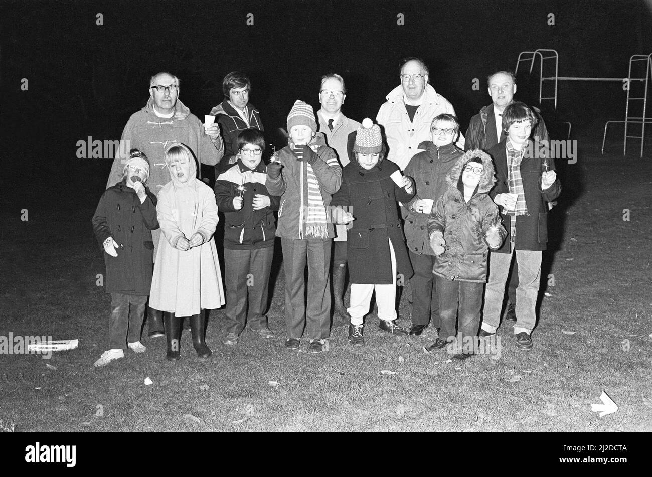 The rector of St Botolph's church, Chevening (left) seen here with pupils, parents and teachers of Dorton House school for the blind on bonfire night. 5th November 1985 Stock Photo