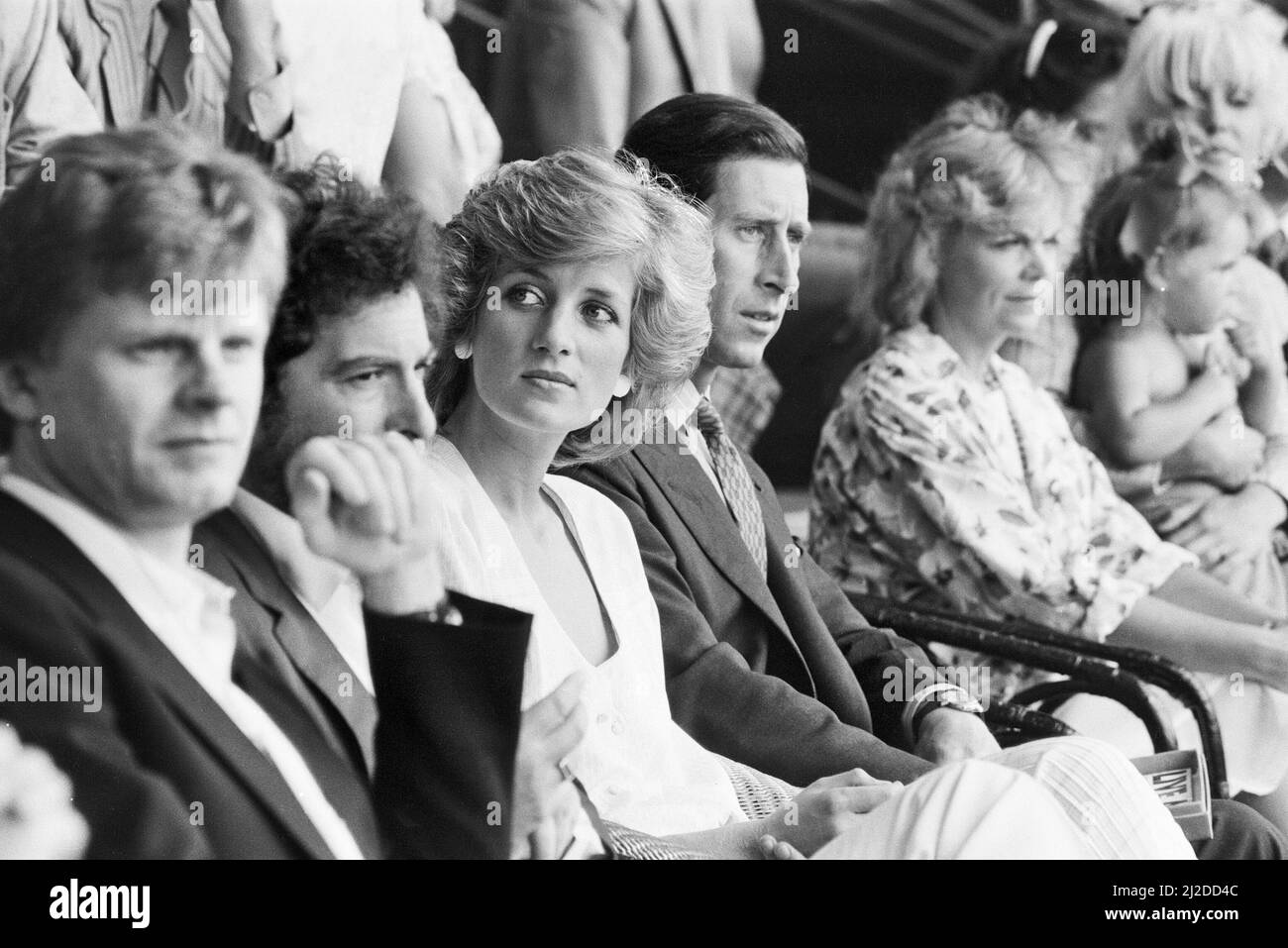 Live Aid dual venue benefit concert held on 13th July 1985 at Wembley Stadium in London, England, and the John F. Kennedy Stadium in Philadelphia, Pennsylvania, United States. The concerts were organised as a follow up to the Band Aid single 'Do They Know Its Christmas?'  to raise money for victims of the famine in Ethiopia. Picture shows  princess Diana and Prince Charles, the Prince and Princess of Wales, watching  the concert at Wembley. Stock Photo